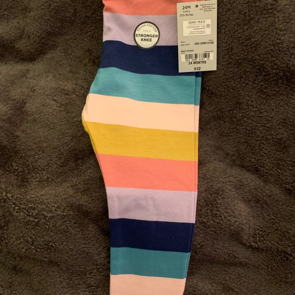 Carters multi colored leggings. Brand New and will match any colored shirt.
